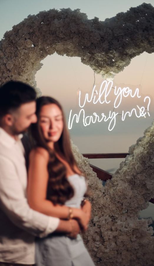 Couple embracing at a proposal, Ace Production